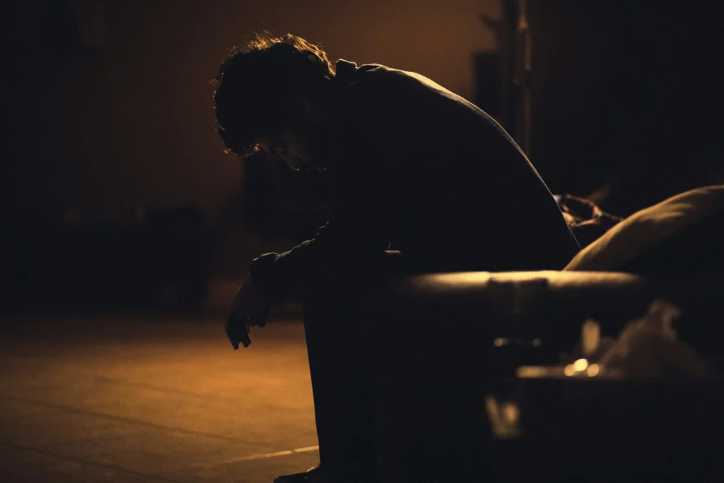 Depressed man sitting alone